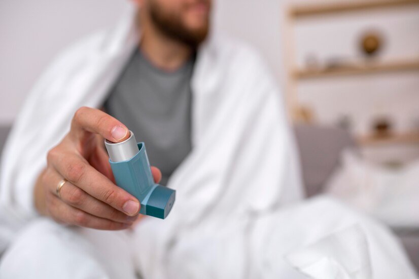 young adult taking medicine through inhaler for Asthma and Allergy treatments